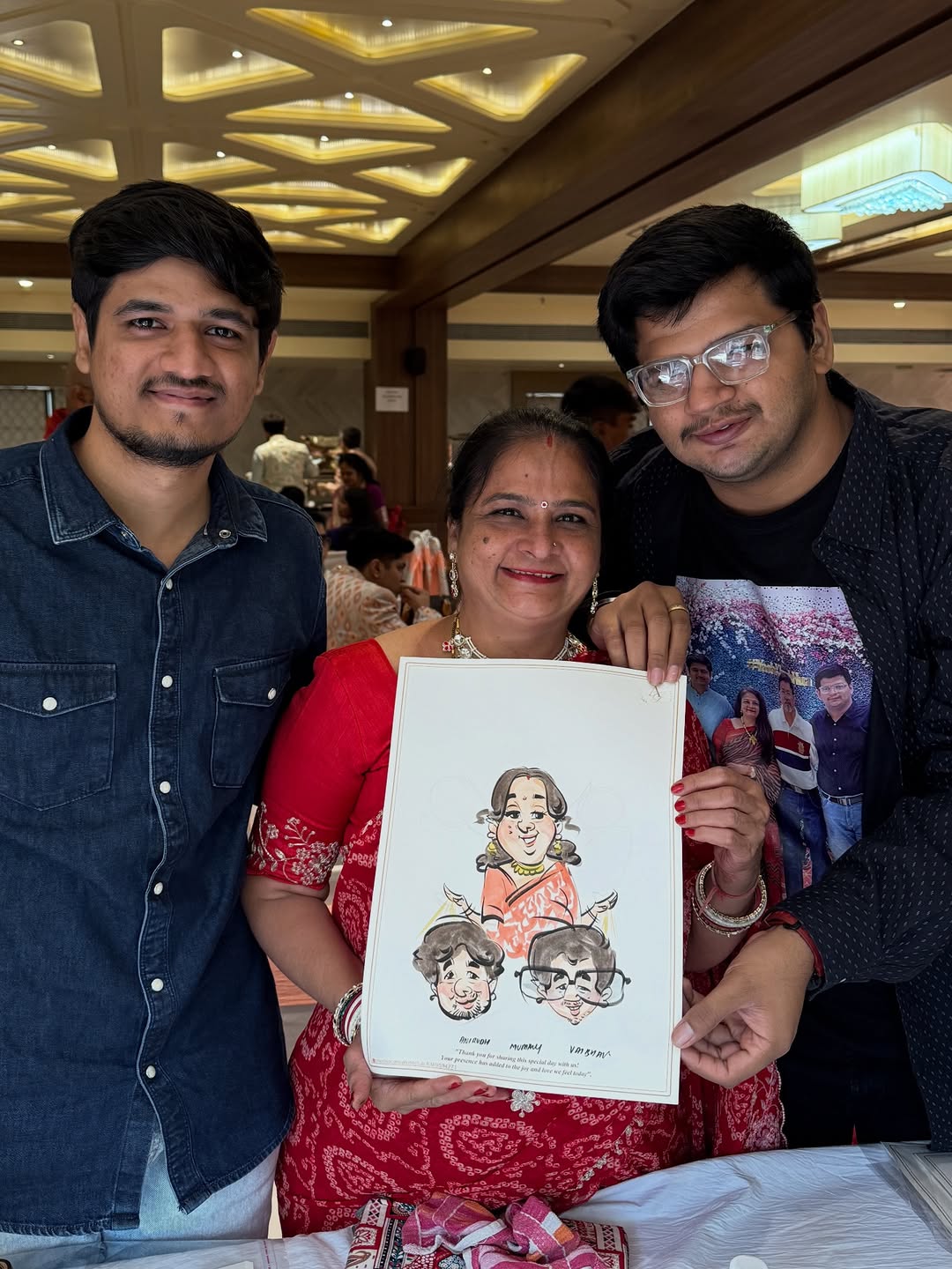 Family of three with a live group caricature drawn at a celebration